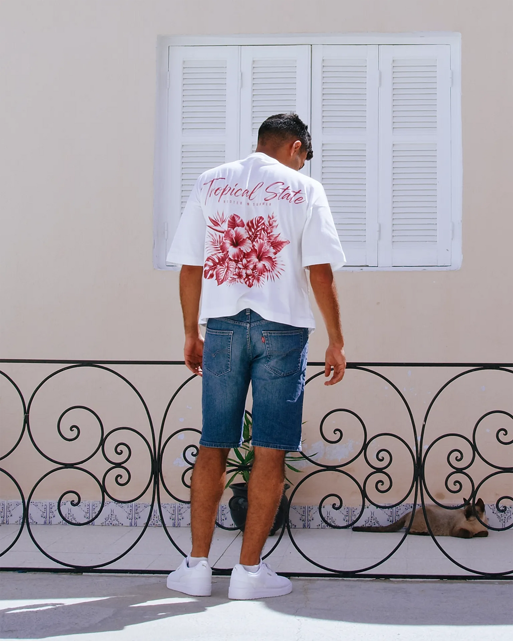 TROPICAL STATE™ White cropped oversized T-shirt featuring vintage-red tropical graphic on the back